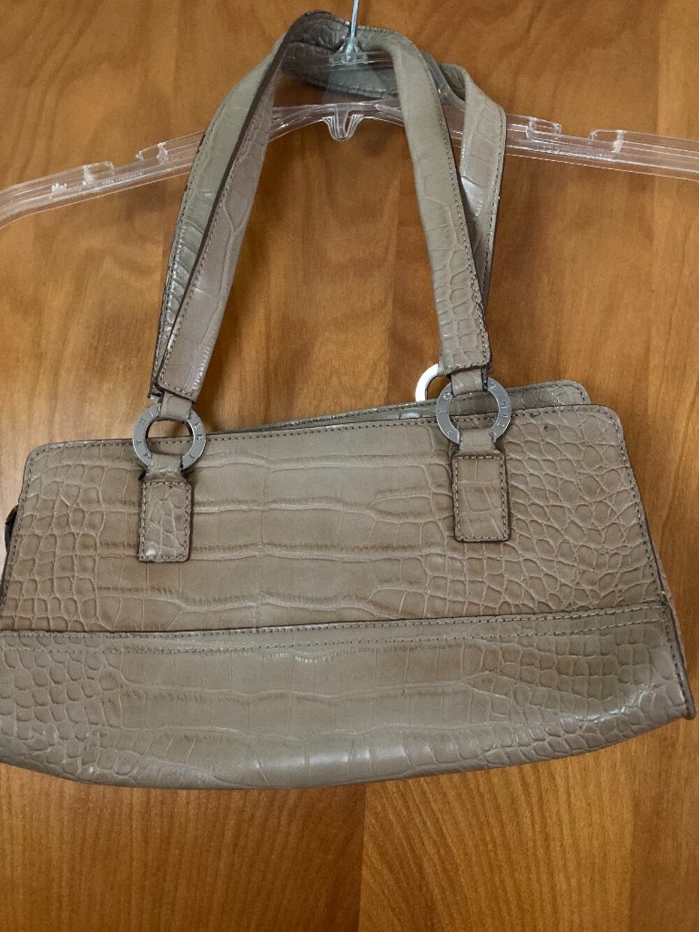 Tommy Hilfiger shoulder bag features a textured faux crocodile pattern